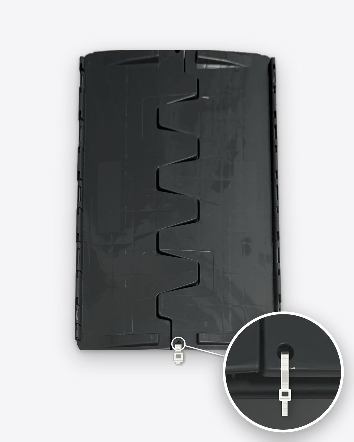 Closed CrateGo crate lid with interlocking flaps and a zip tie through the end hole